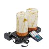 Twee cilindervormige, marmer-goud oplaadbare LED tafellampen met houtlook staan op een zwarte laadtray naast een afstandsbediening en een netadapter met snoer.