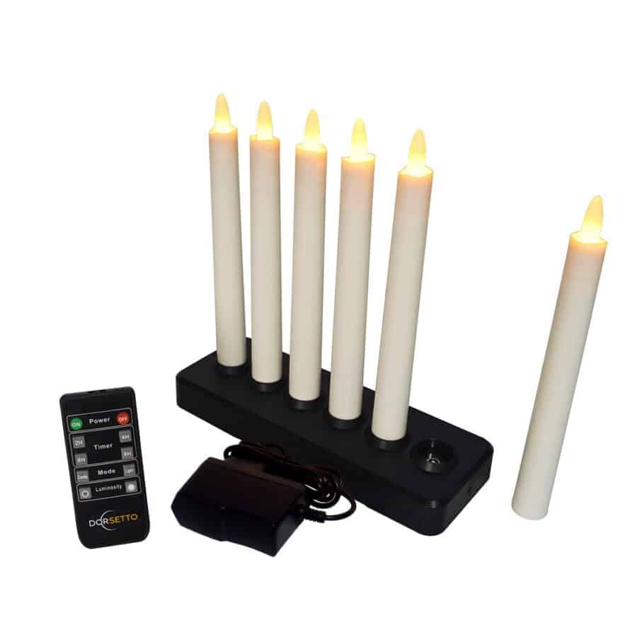 De Oplaadbare LED dinerkaarsen 197mm set bevat 6 oplaadbare warmwitte kaarsen (tot 130 uur), oplaadbasis, voedingsadapter en zwarte afstandsbediening - perfect voor een langdurige sfeer.